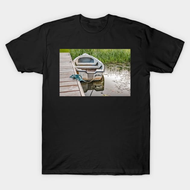 Boat tied to wooden staging on the Norfolk Broads T-Shirt by yackers1